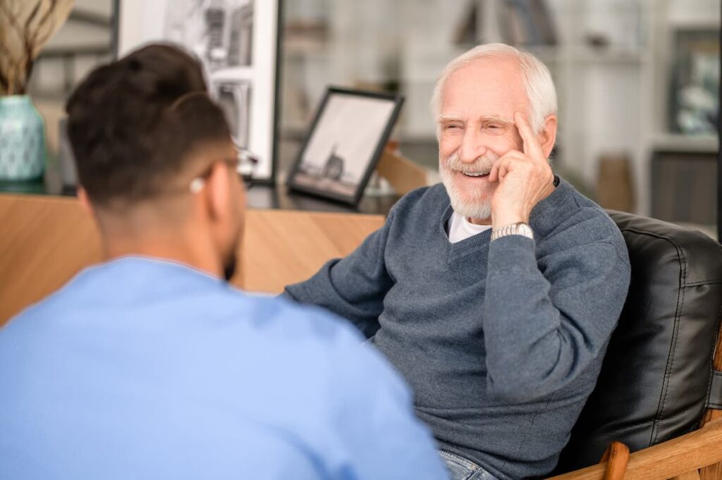 Broadway Mesa Village | Resident getting advice from a caretaker