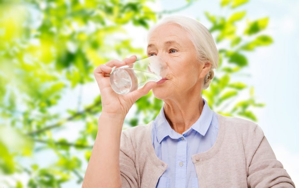 Creston Village | Senior woman drinking water