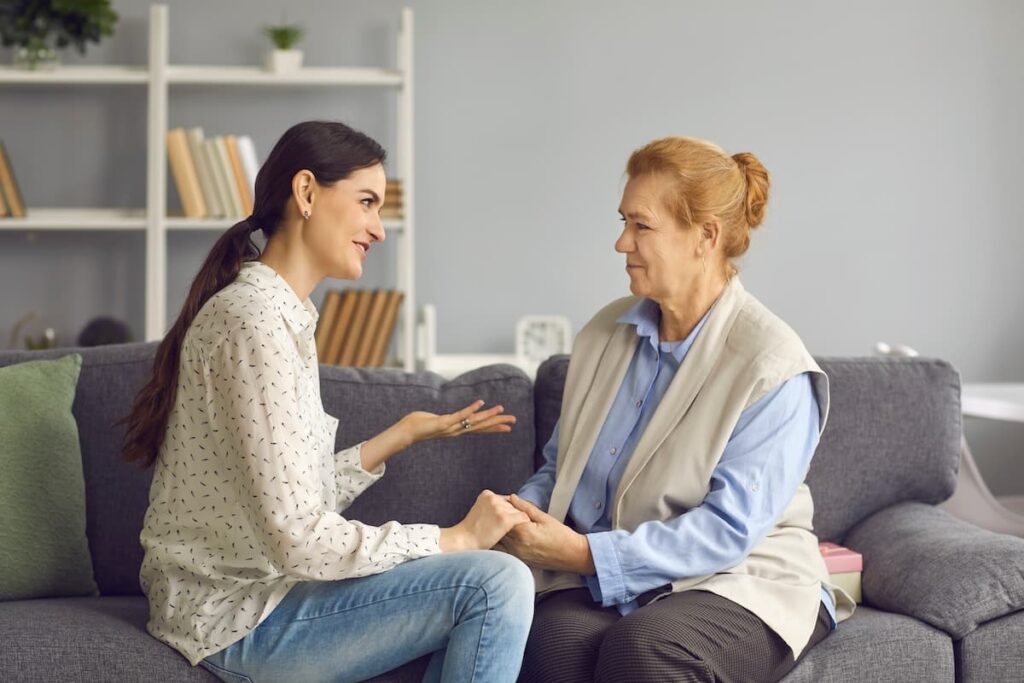 Evergreen Place | Mother And Daughter Talking On The Sofa