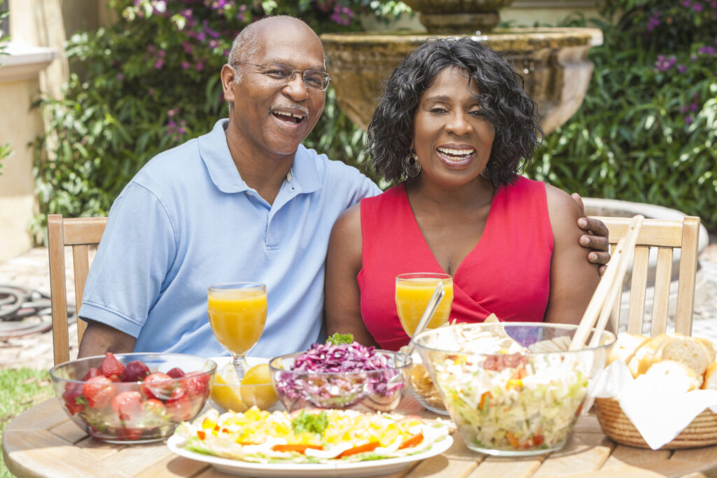 Laketown Village | Senior couple eating outside