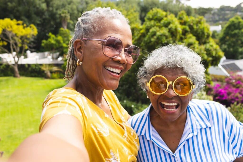 Magnolia Place of Roswell | Senior women in colorful sunglasses laughing