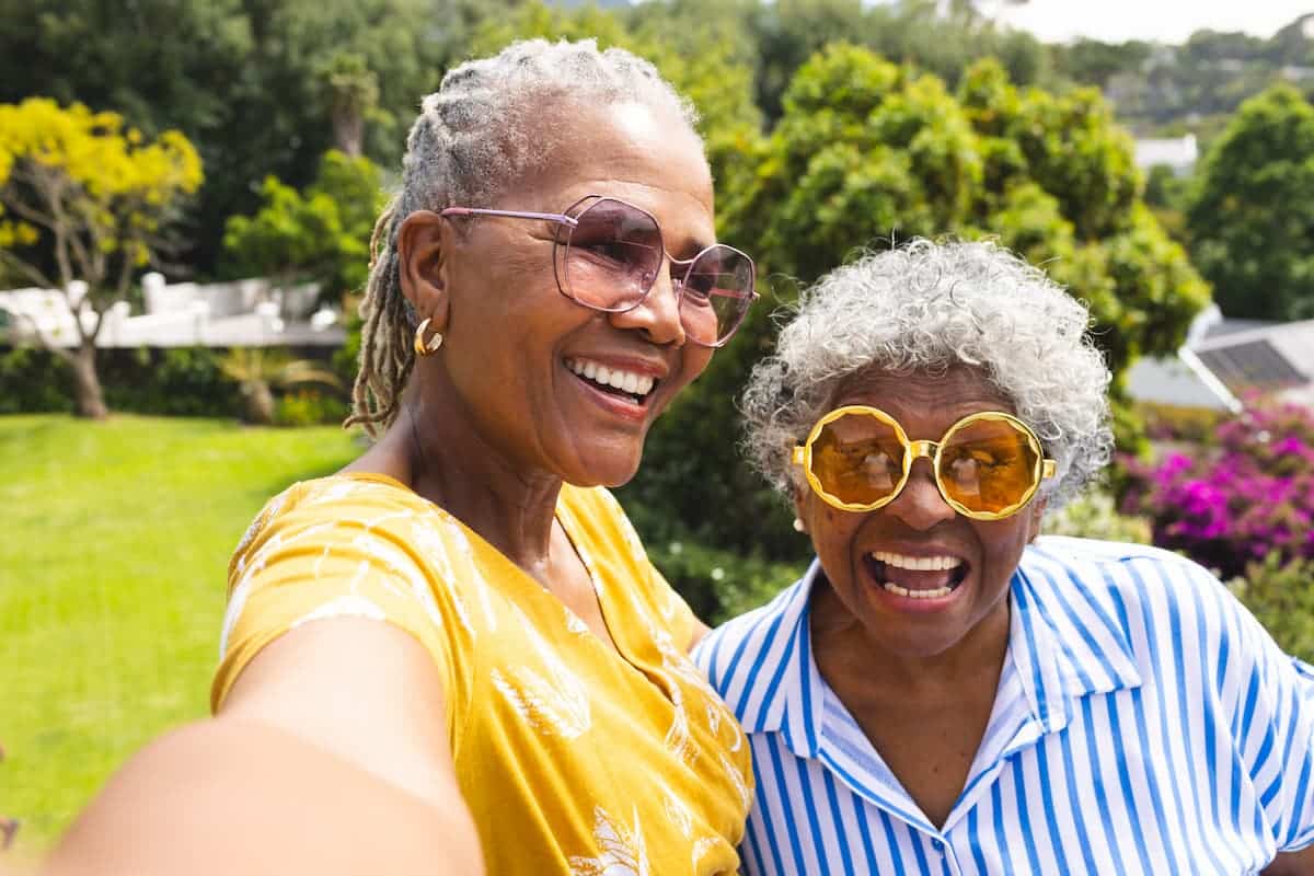 Magnolia Place of Roswell | Senior women in colorful sunglasses laughing