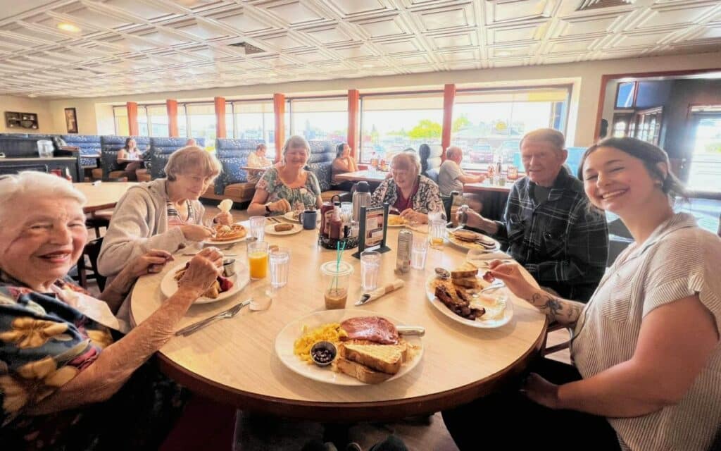 Pegasus | Residents sitting around a dinner table