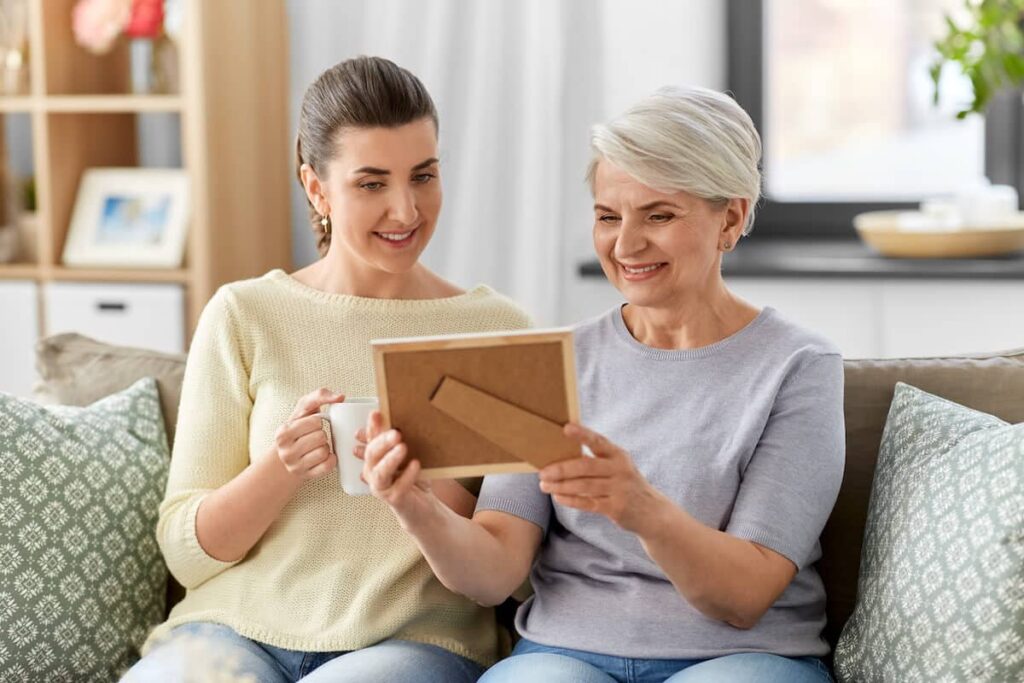 Pegasus Landing of Mesa | Senior woman and her daughter looking at a picture in a frame