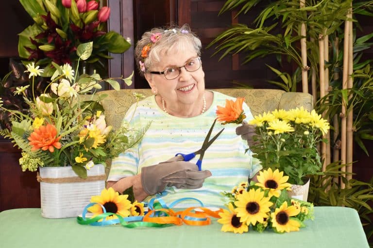 Pegasus Landing of Mesa | Senior woman creating floral crafts