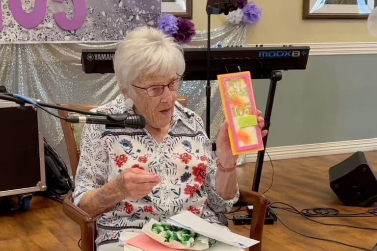 Pegasus Landing of Mesa | Senior resident showing her birthday cards