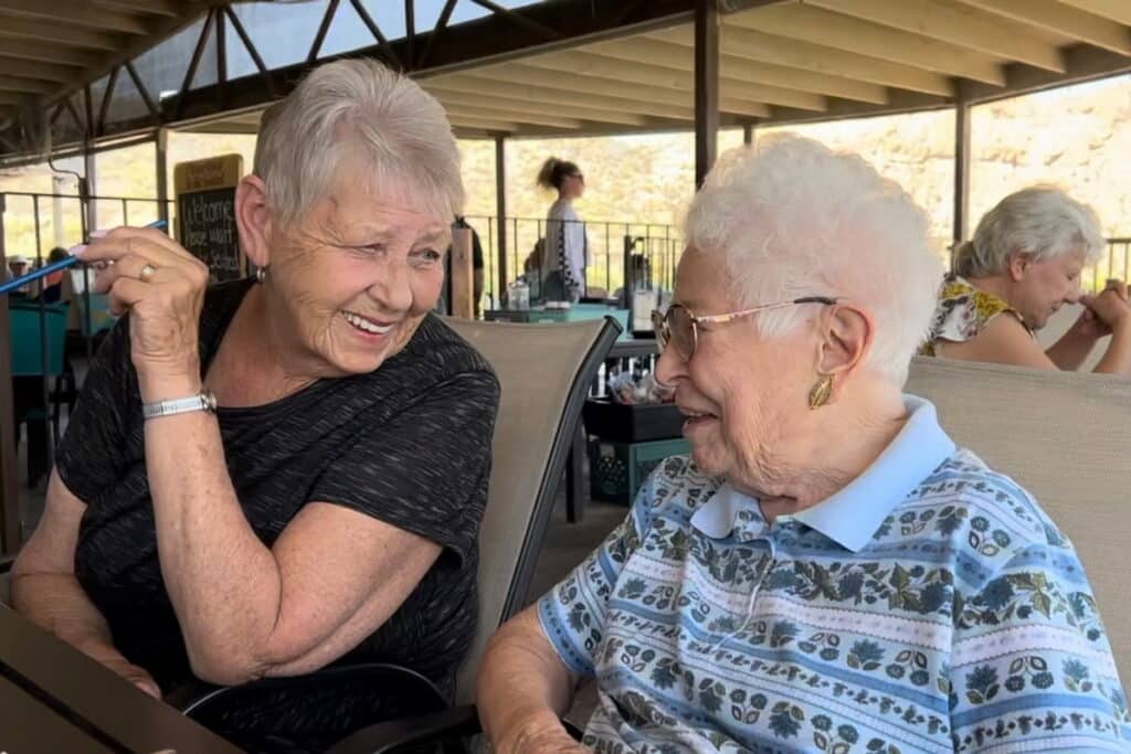 Pegasus Landing of Mesa | Volunteer laughing with resident