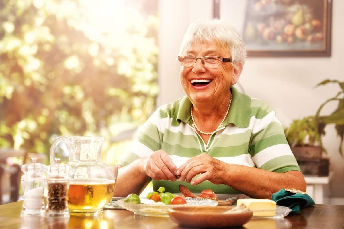 Pegasus Landing of Overland Park | Senior woman eating breakfast