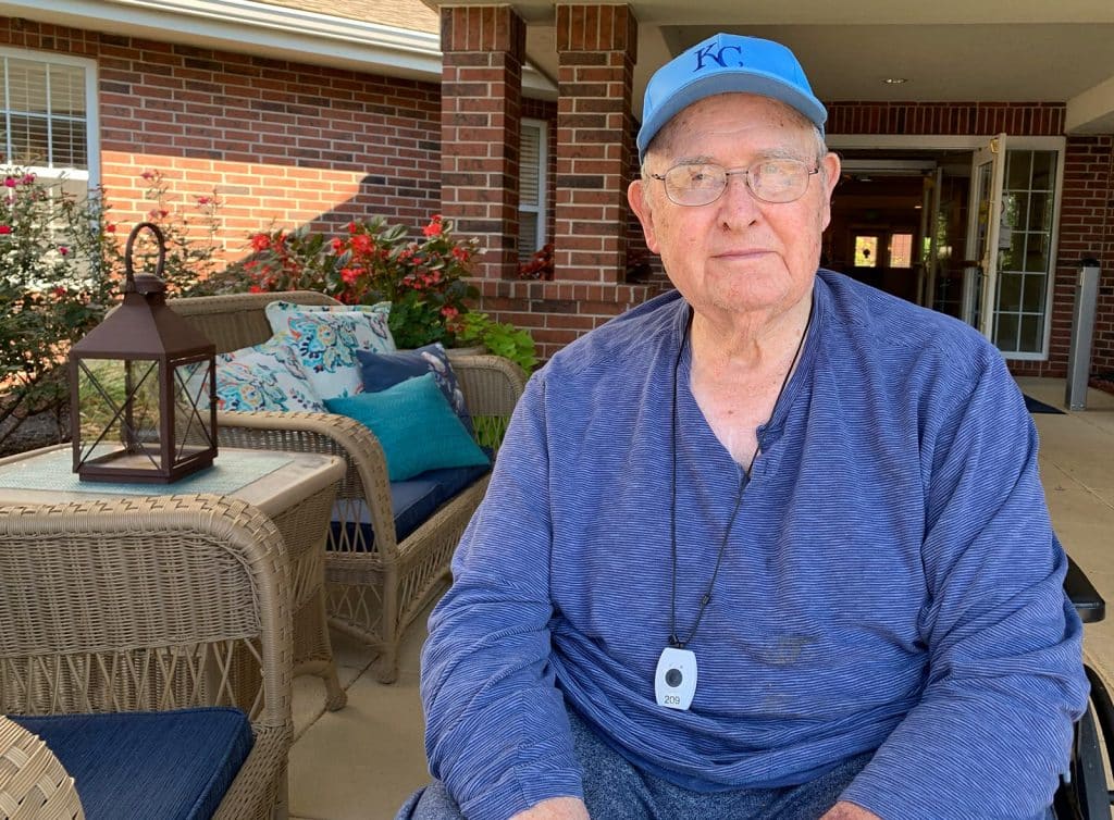 Pegasus Landing of Overland Park | Senior man sitting on porch