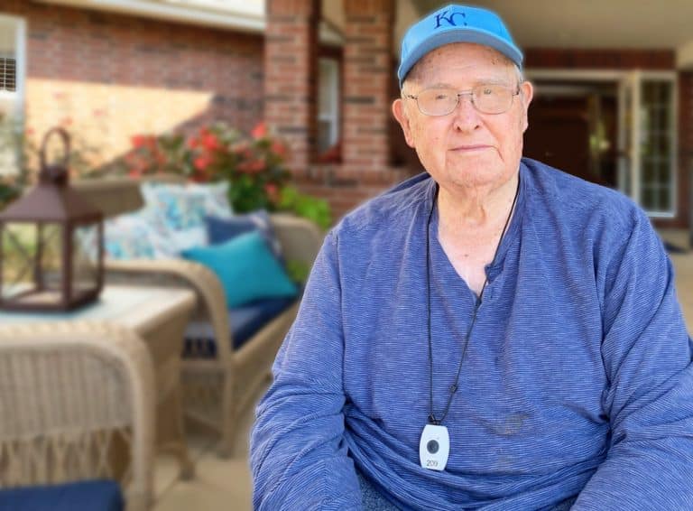 Pegasus Landing of Overland Park | Senior sitting on porch