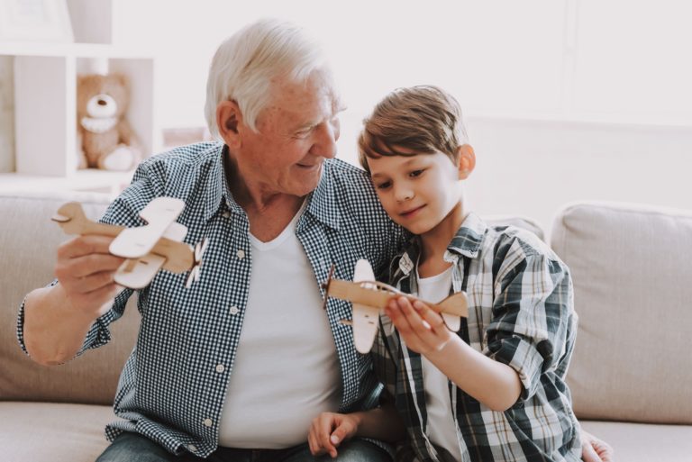 Pegasus Landing of Overland Park | Senior flying model airplanes with grandson