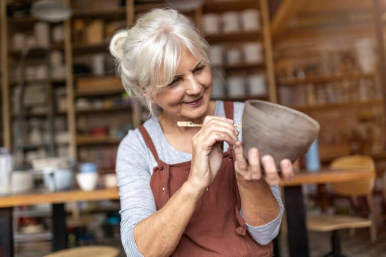 Pegasus Landing of Overland Park | Senior woman creating pottery