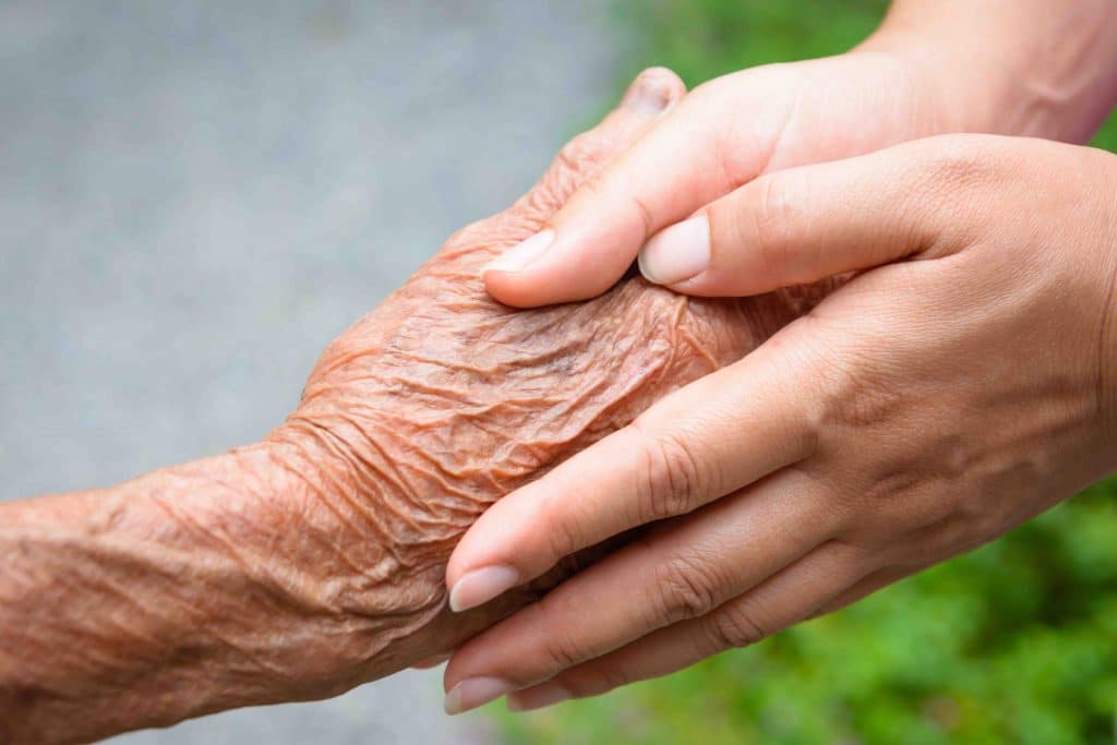 Pegasus Landing of Tanglewood | Senior holding hands with caregiver