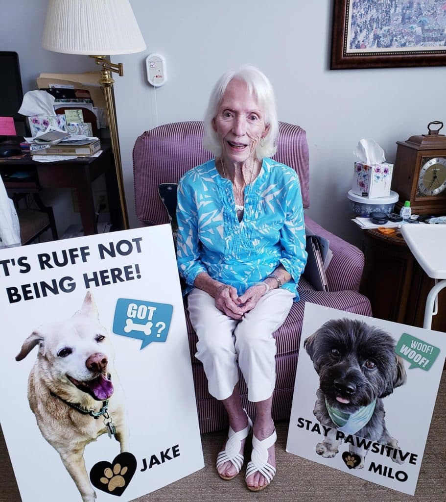 Pegasus Landing of Tanglewood | Resident with dog posters