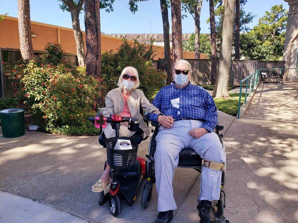 Pegasus Landing of Tanglewood | Resident couple sitting outdoors