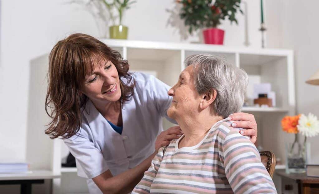 Pegasus Landing of Tanglewood | Nurse with her hands on the shoulder of a senior woman