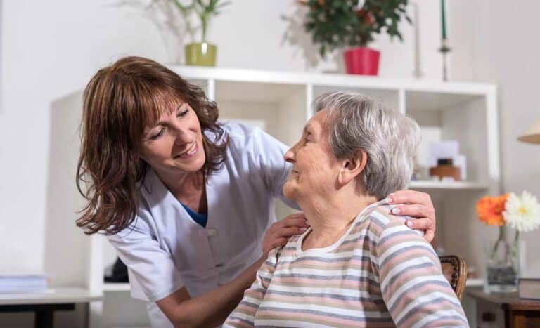 Pegasus Landing of Tanglewood | Nurse with her hands on the shoulder of a senior woman