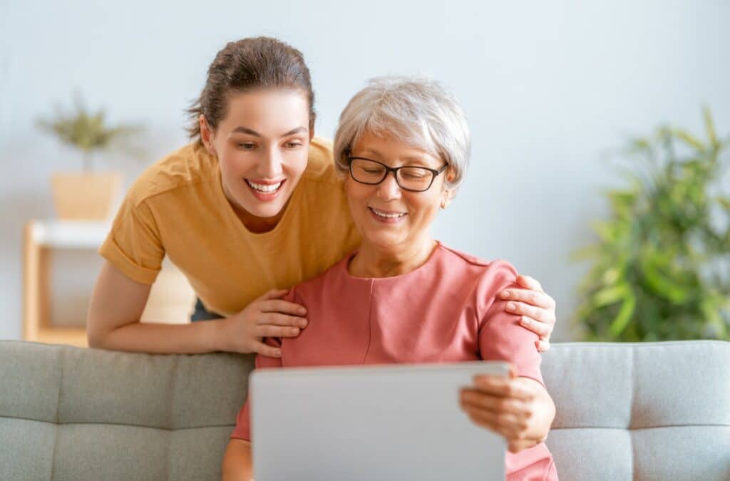 Pegasus Landing of Tanglewood | Senior woman looking at computer with young woman