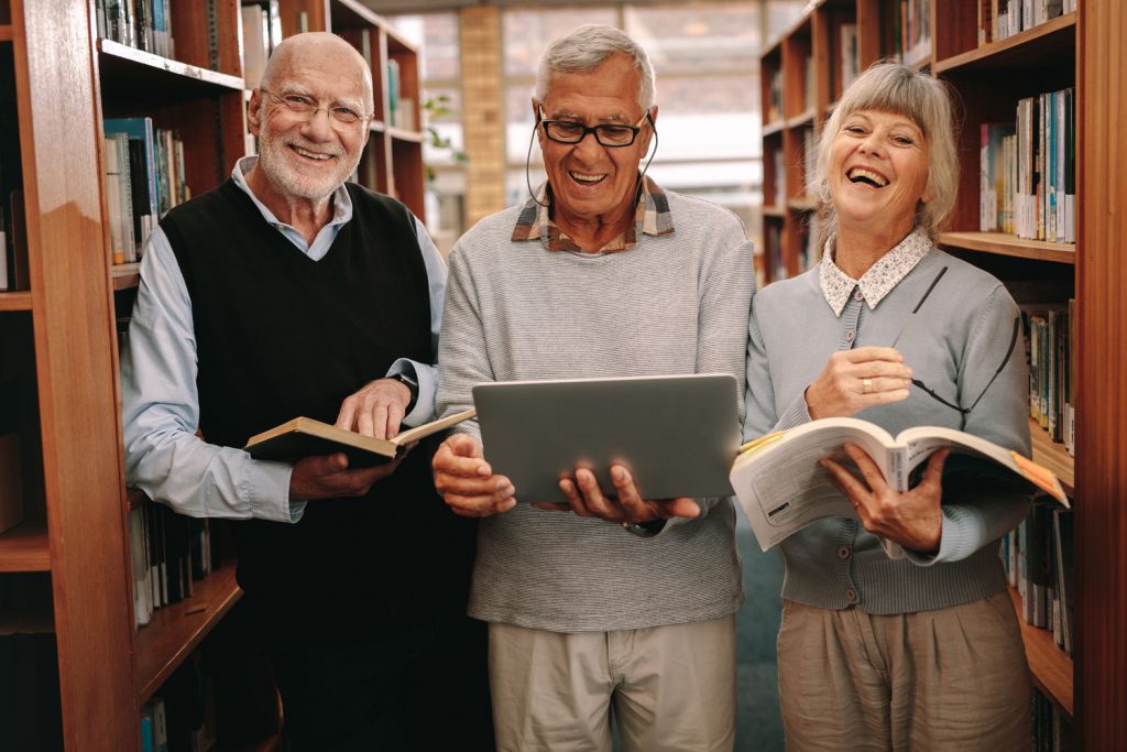 Ridgeland Place | Residents in library