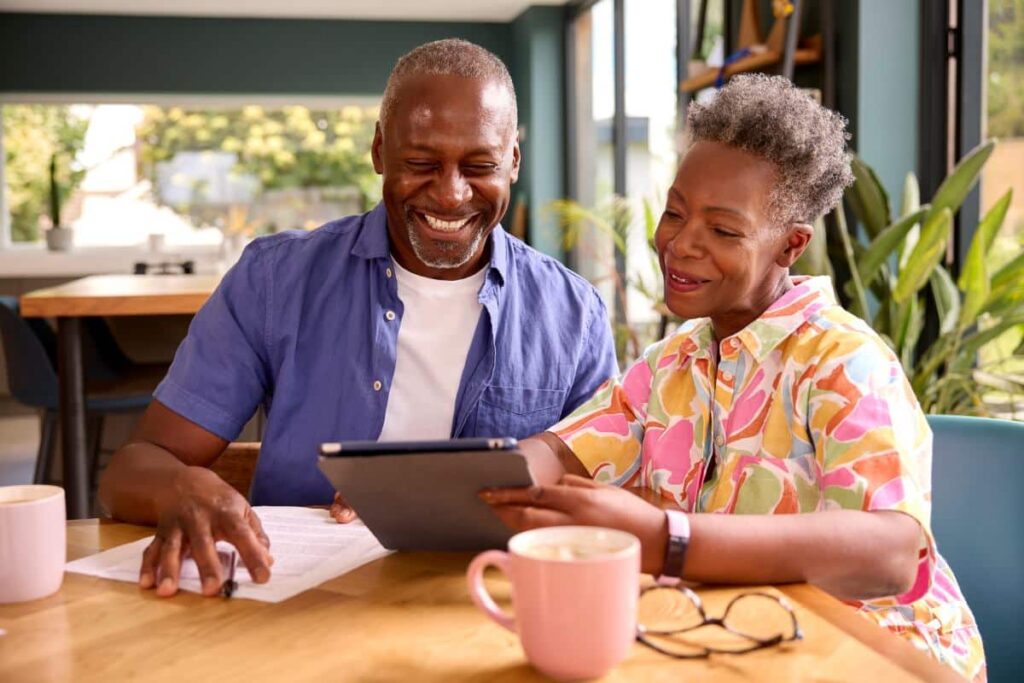 Pegasus Senior Living | Couple using tablet to measure finances