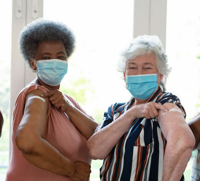 Pegasus Senior Living | Seniors showing they got a booster shot