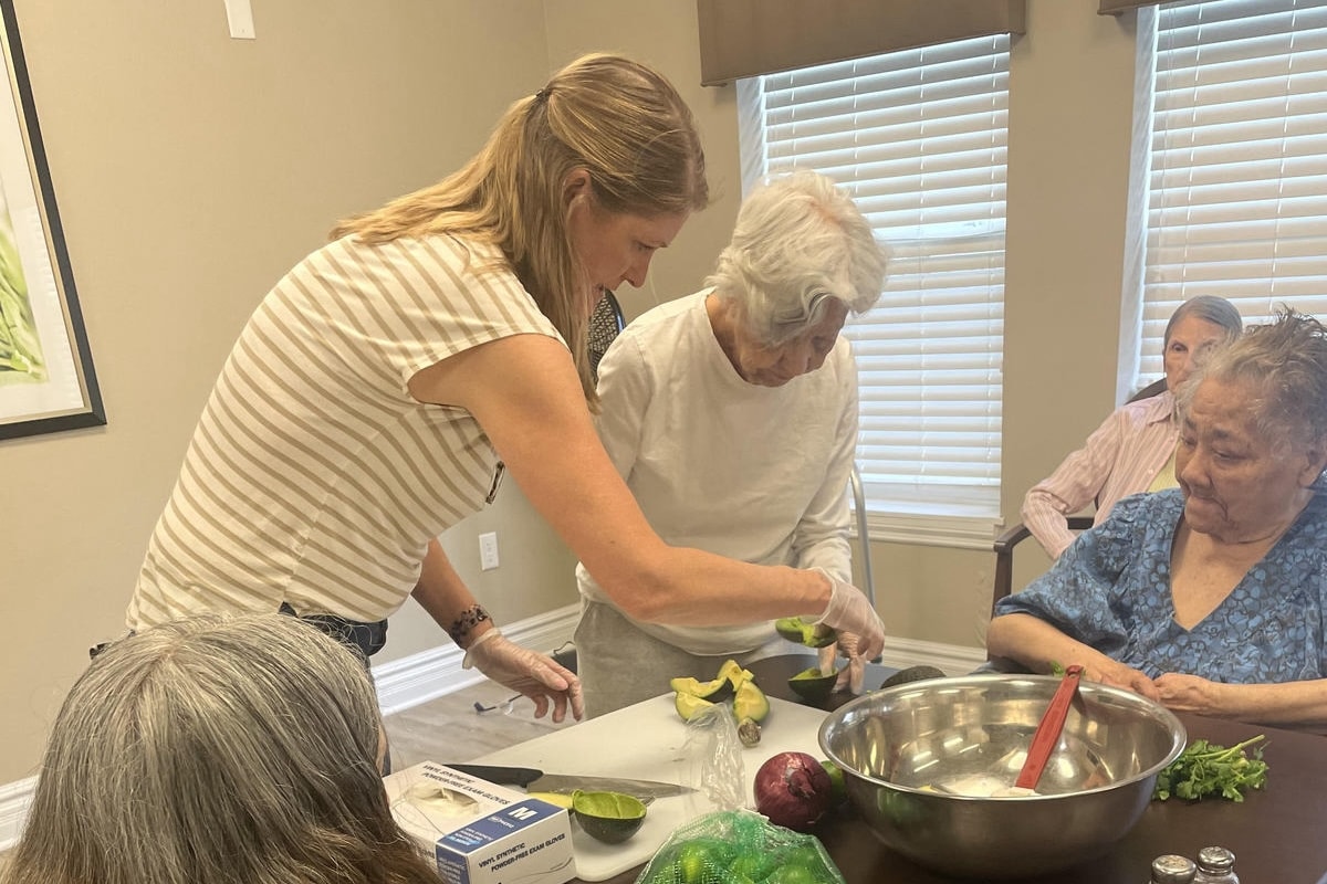 Courtyards at Mountain View | Molly leading a cooking activity