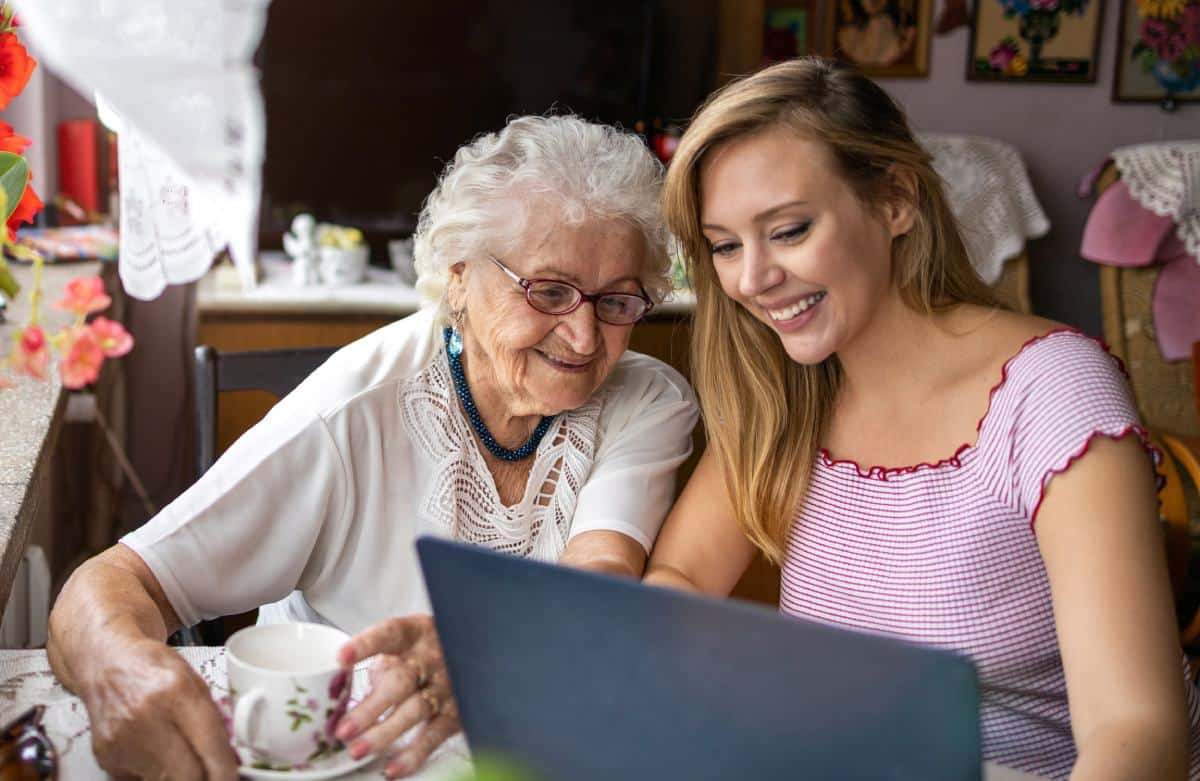 Pegasus Senior Living | Senior woman and daughter reading on laptop