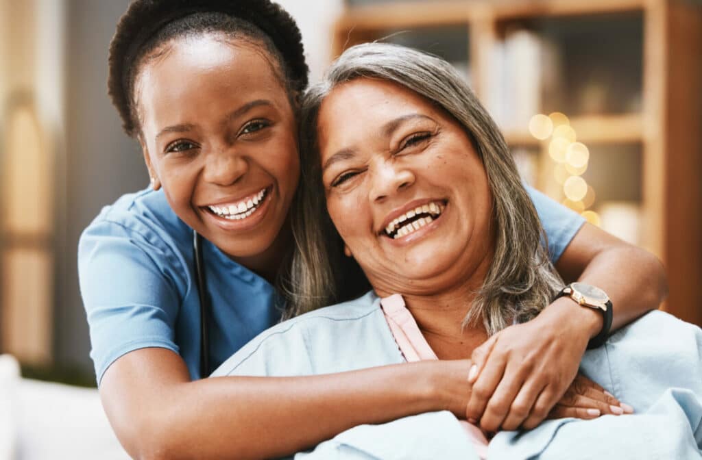 The Legacy at Cimarron in El Paso | Senior woman and nurse hugging