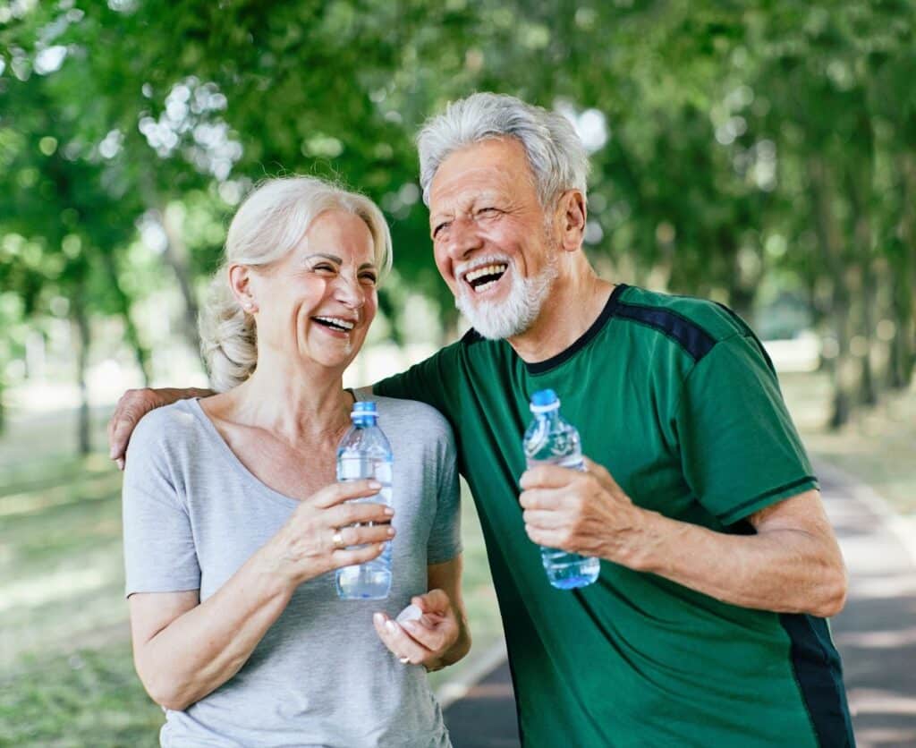 The Legacy at Cimarron in El Paso | Senior couple drinking water