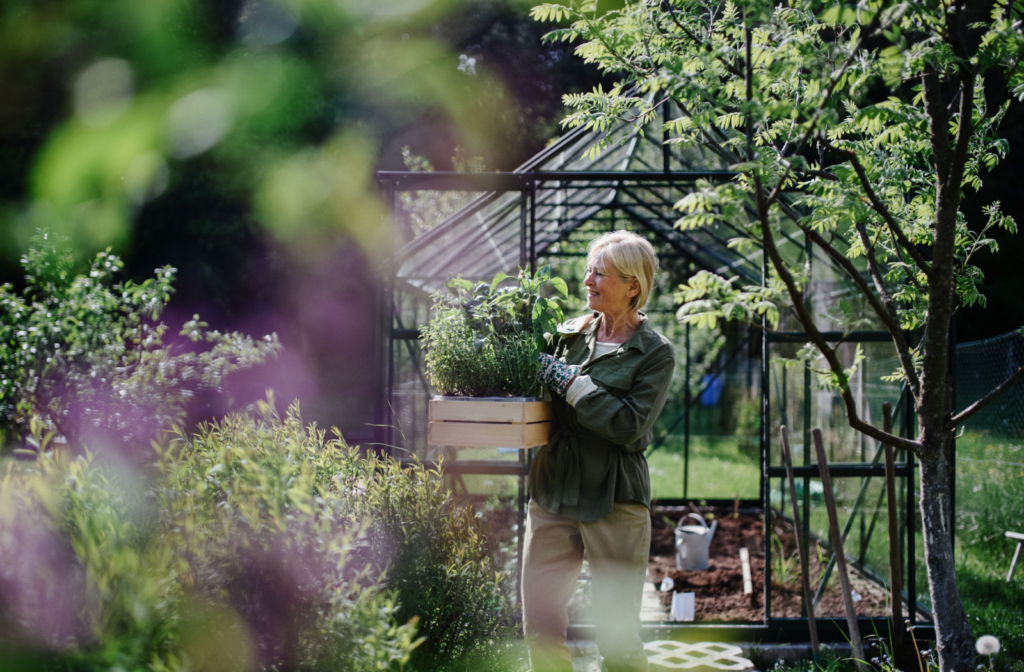 The Legacy at Cimarron in El Paso | Older woman in a greenhouse