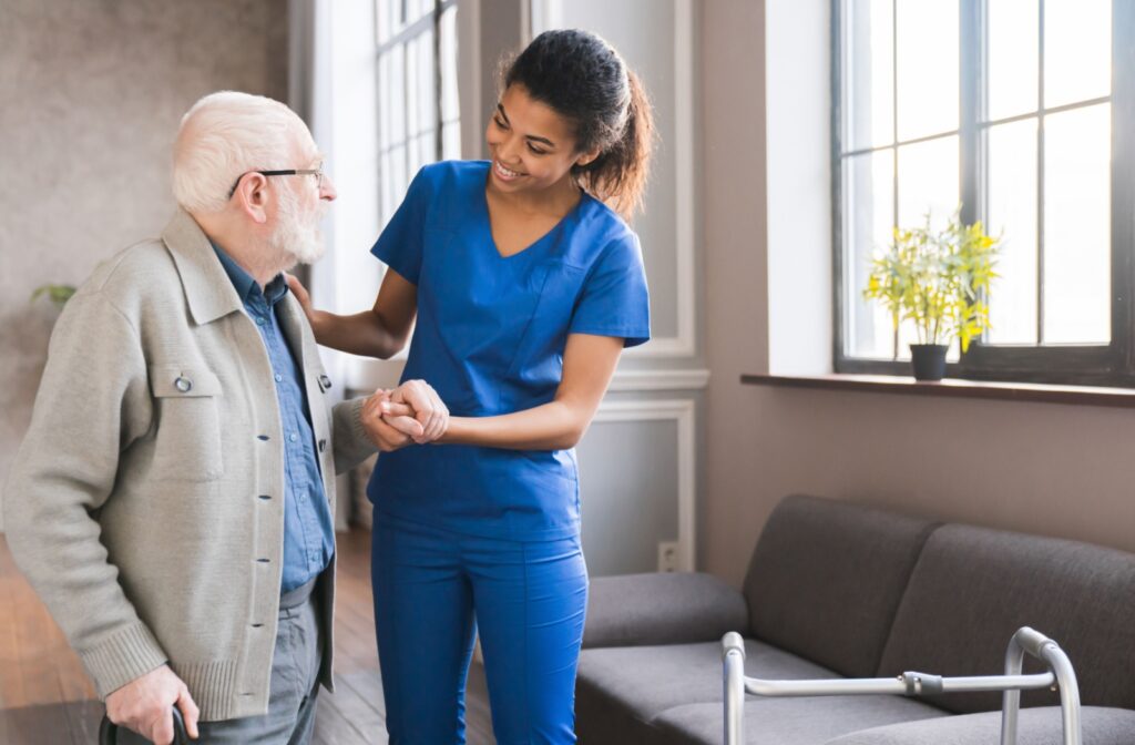 The Legacy at Crystal Falls in Leander | Nurse helping an older man walk