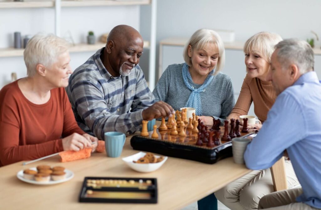 The Legacy at Crystal Falls in Leander | Group of seniors playing chess