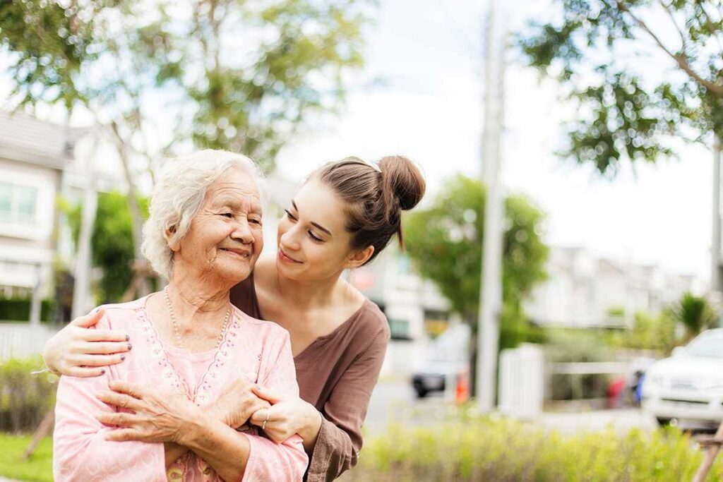 The Legacy at Crystal Falls in Leander | Senior Woman And Adult Daughter Smiling and Hugging