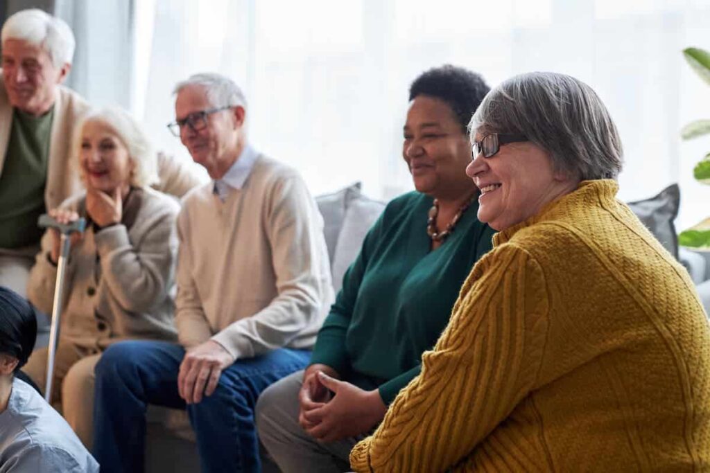 The Legacy at Forest Ridge | Group of Smiling Senior Watching Television