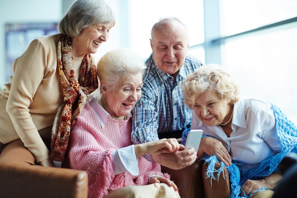 The Legacy at Forest Ridge | Happy seniors using smartphone