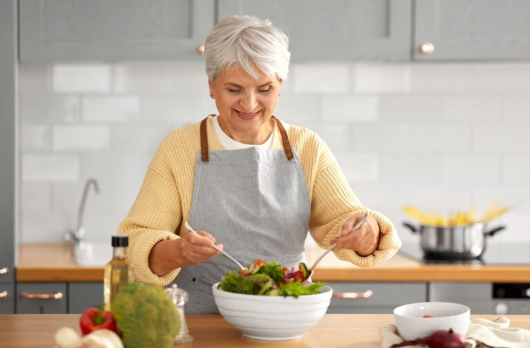 The Legacy at Long Meadow in Richmond | Senior woman preparing a salad