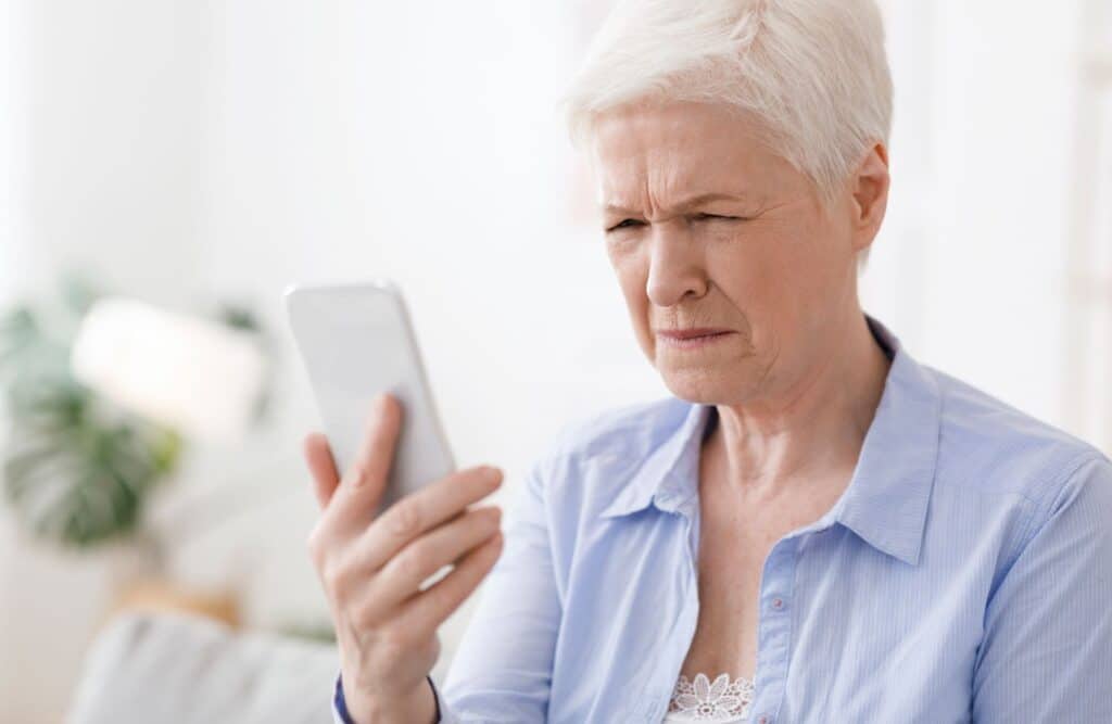 The Legacy at Long Meadow in Richmond | Senior woman staring at her phone