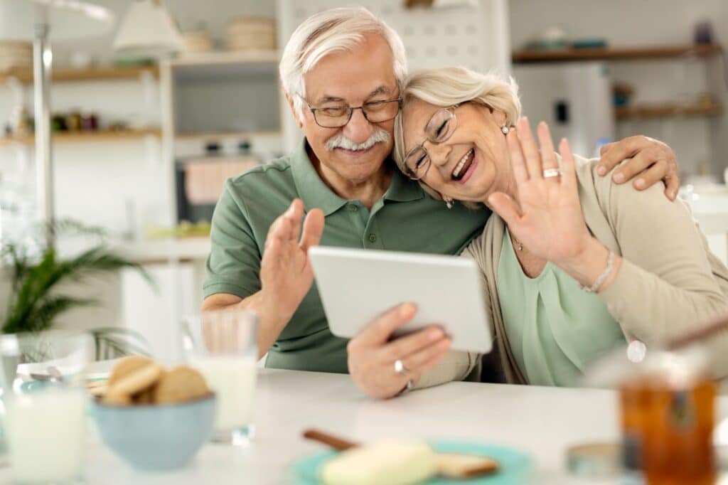 The Legacy at Long Meadow in Richmond | Seniors couple doing a video call