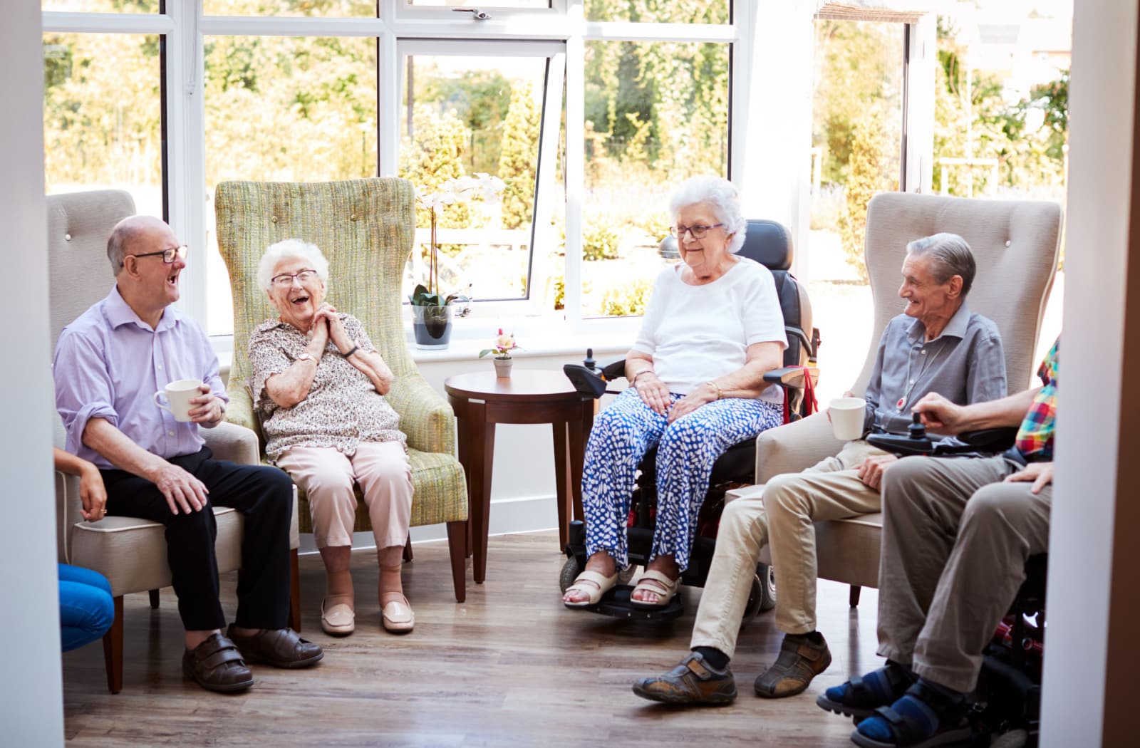 Pegasus Senior Living | Group of seniors talking and laughing