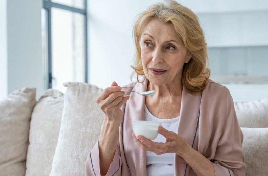 The Legacy at South Plains | Senior Woman Enjoys a Bowl of Yogurt