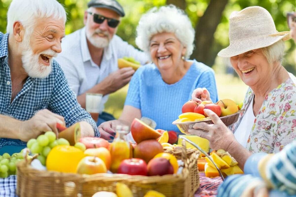 The Legacy At Town Square | Group Of Seniors Enjoying A Picnic Outdoors