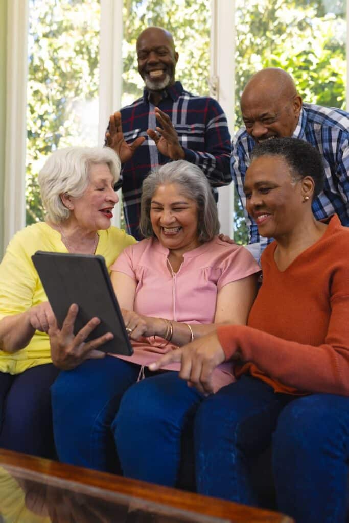 The Legacy at Town Square | Seniors looking at tablet together