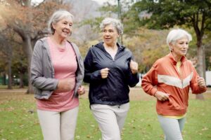 The Rivers at Puyallup | Three Seniors Walking Briskly In The Park