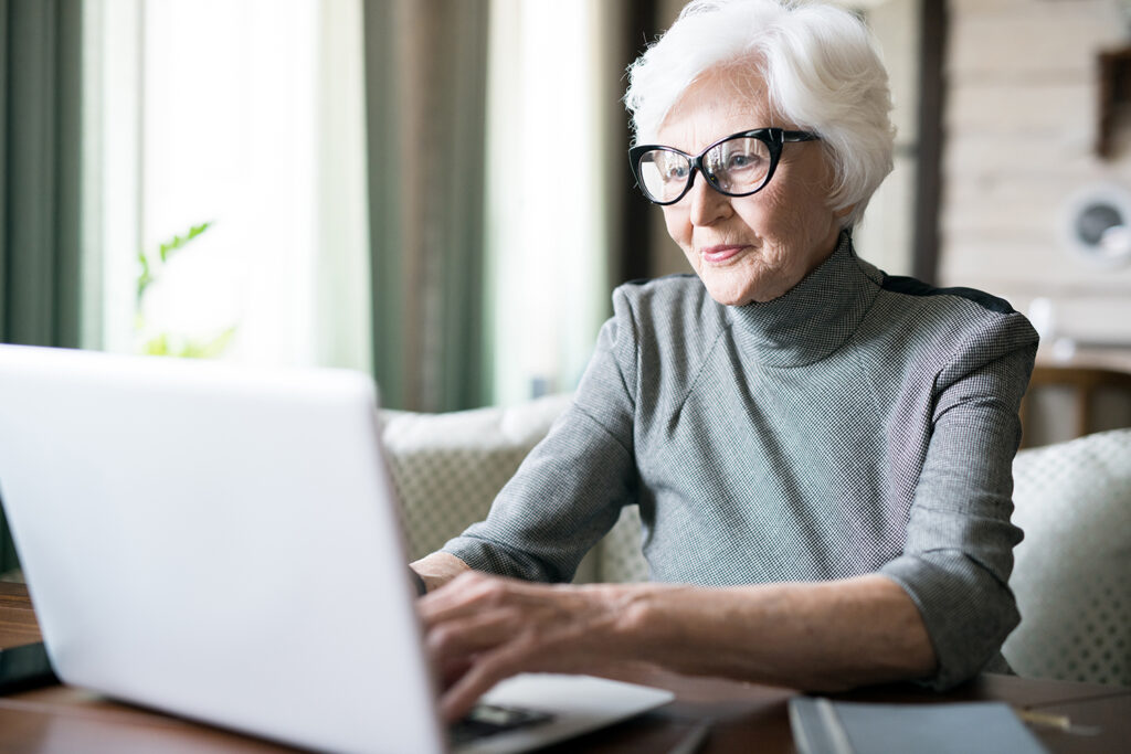 The Seasons of Reno | Senior woman using computer