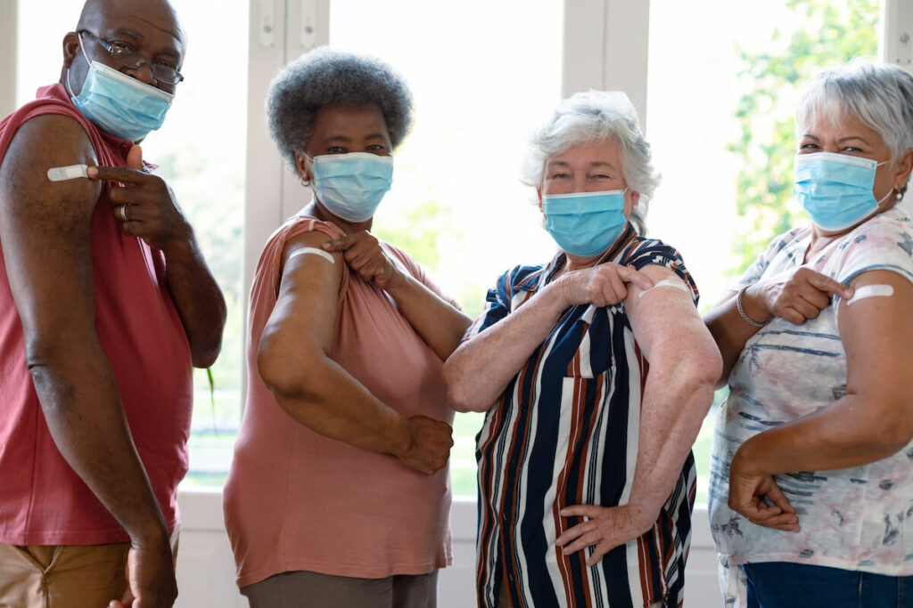 Pegasus Senior Living | Seniors showing they got a booster shot