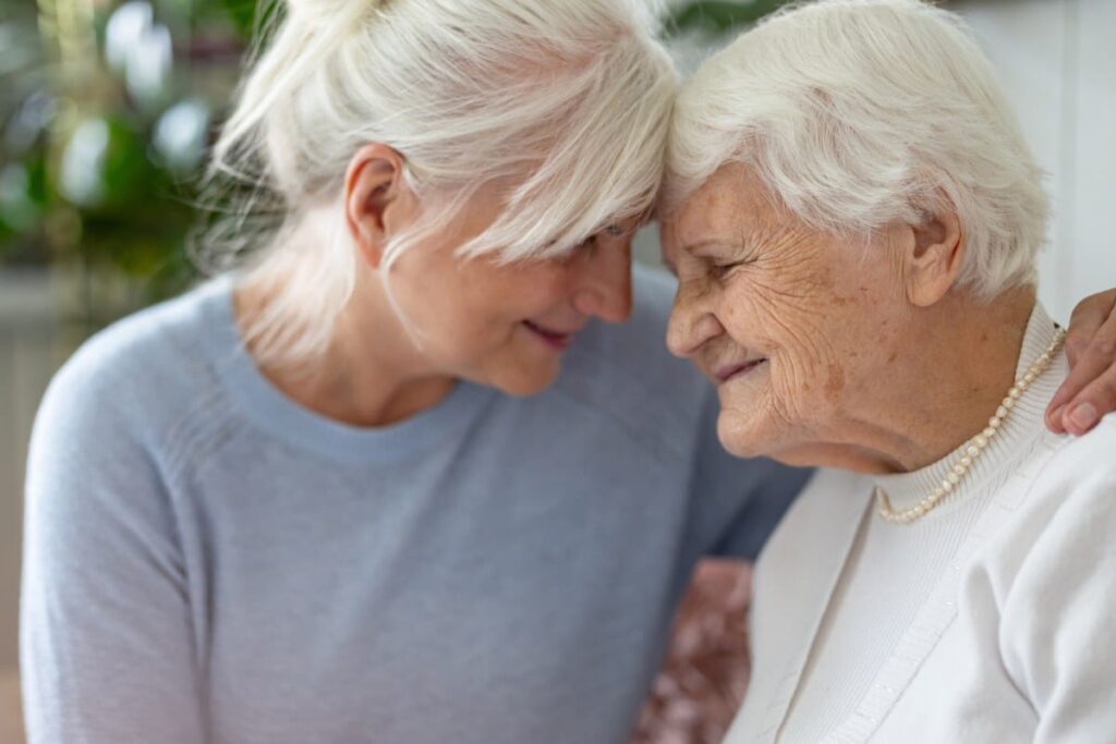 Pegasus Senior Living | Daughter comforting elderly mother