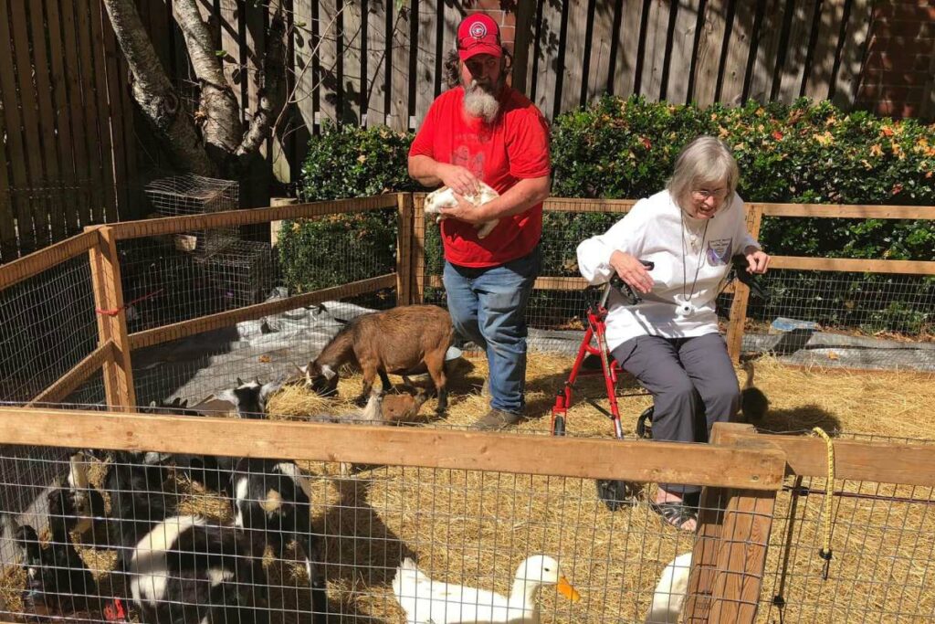 Magnolia Place of Roswell | Our Georgia memory care community supports residents with outdoor activities like pet therapy.