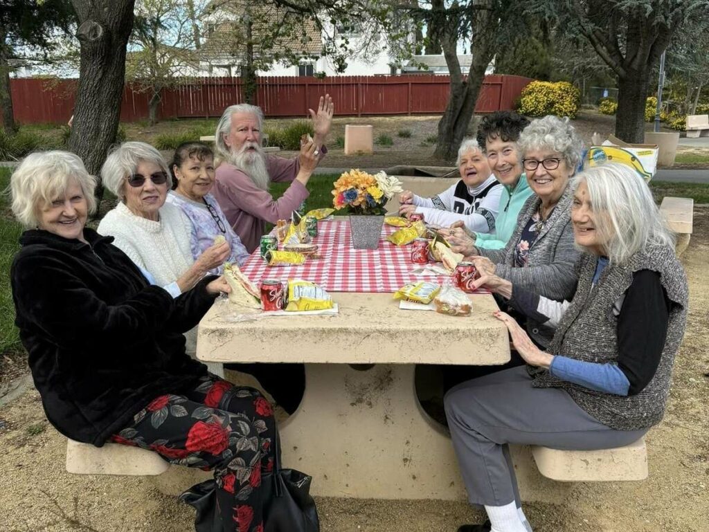 The Village At Rachno Soloano | Residents at a picnic table