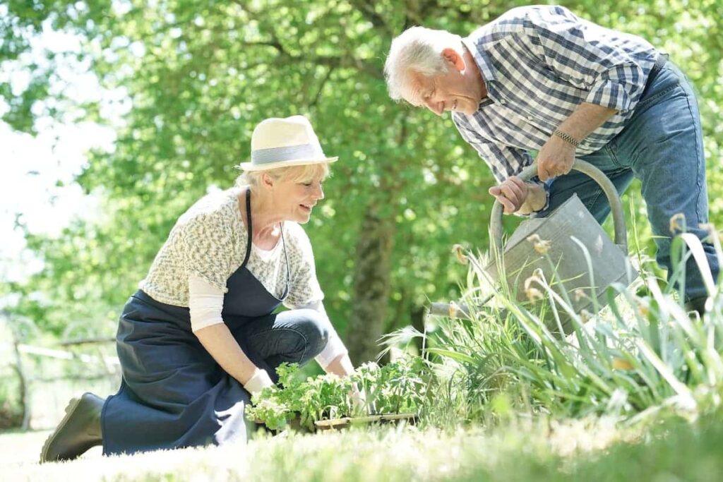 The Rivers at Puyallup | Seniors gardening on a bright day