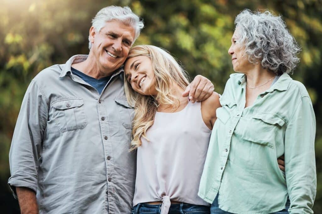 Chisholm Trail Estates | Seniors And Daughter Walking Outside